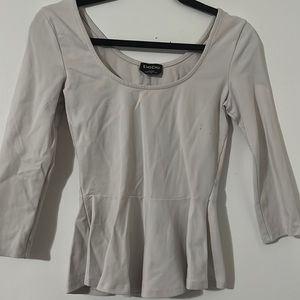 Peplum top Bebe. Very light cream/pinkish color